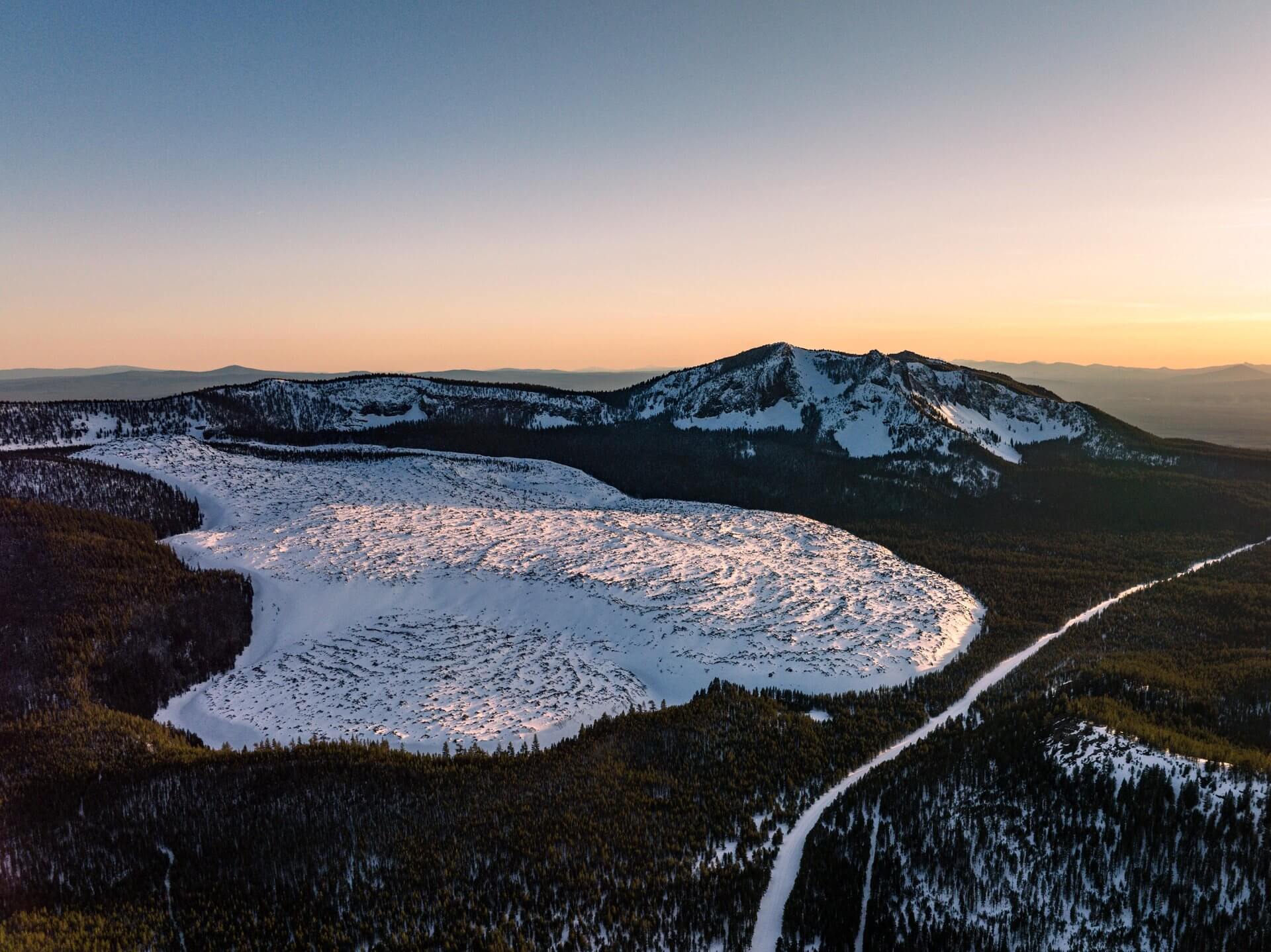 Ice- and snow-covered Paulina Lake, within the Newberry National Volcanic Monument, just outside of La Pine, Oregon