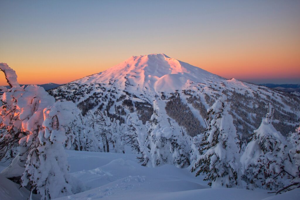 The sun rising over a snow-covered Mount Bachelor in Bend, Oregon.