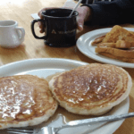 Norma's Red Rooster pancakes and sandwich