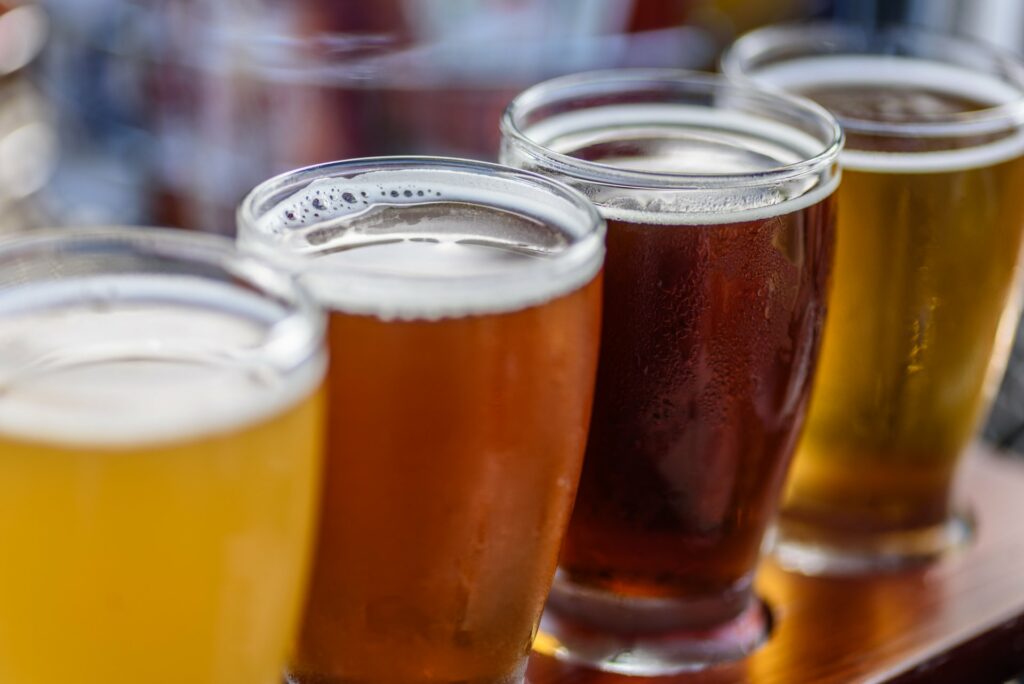Row of beer in tasting glasses lined up