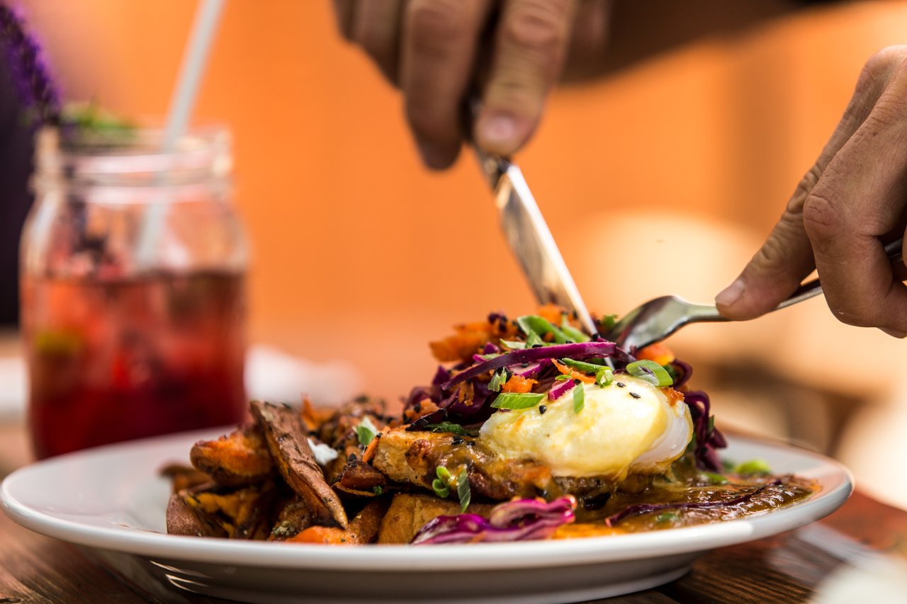 A heaping plate of seasonal eggs benedict at Chow restaurant in Bend, Oregon.