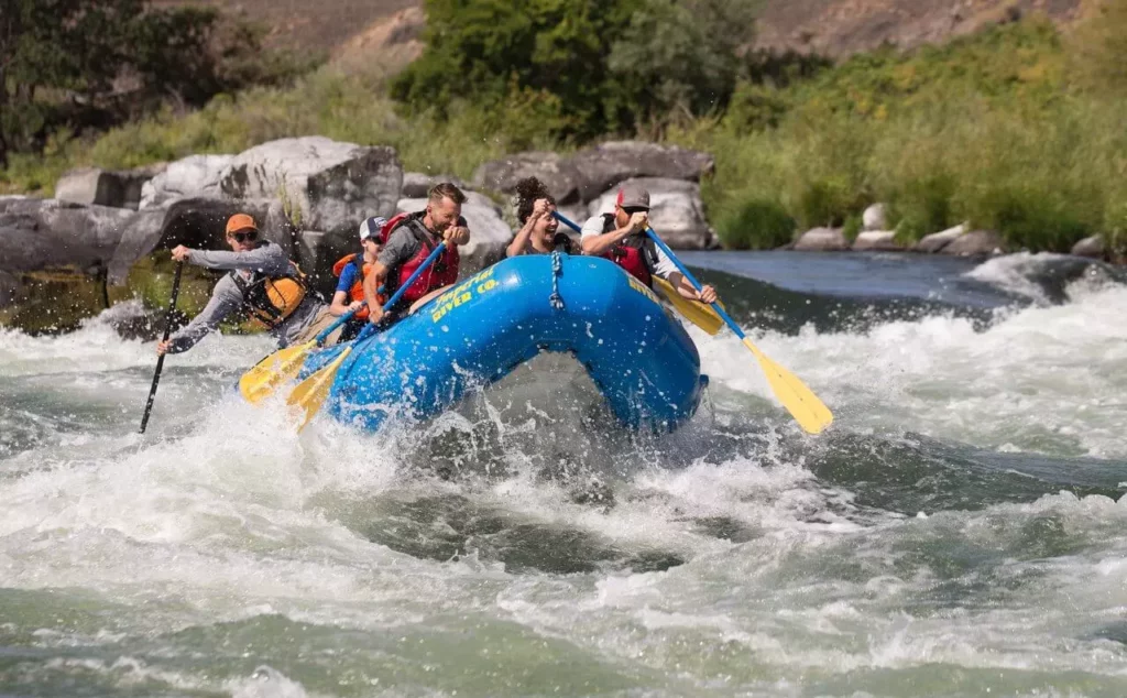 People raft down a rapid