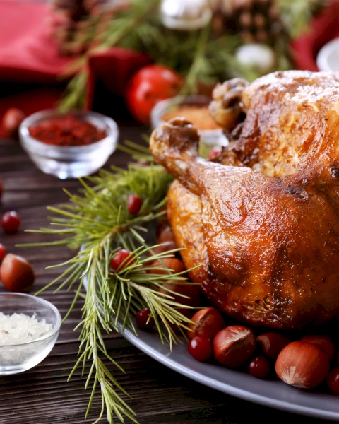 A roasted turkey surrounded by festive decorations and seasonal ingredients in Central Oregon.