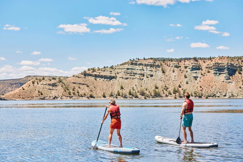 Stand-up paddleboarding at Prineville Reservoir near Prineville, Oregon
