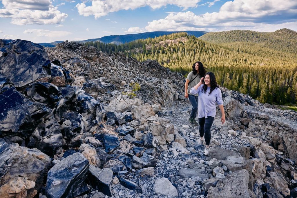 Hiking the Big Obsidian Flow at Newberry National Volcanic Monument near La Pine, Oregon