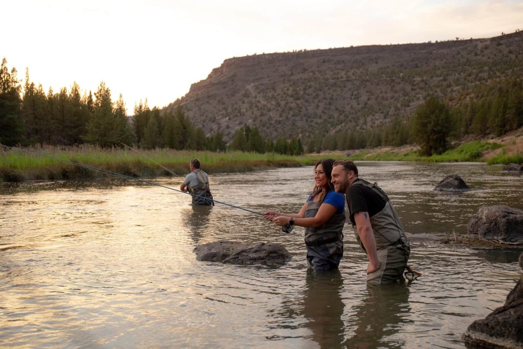 Couple fishing in the Crooked River near Prineville, Oregon