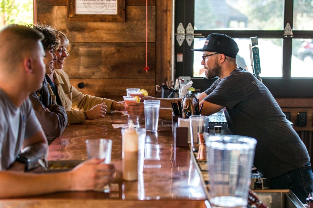Bartender serving drinks at the Ski Inn Taphouse and Hotel in Sisters, Oregon