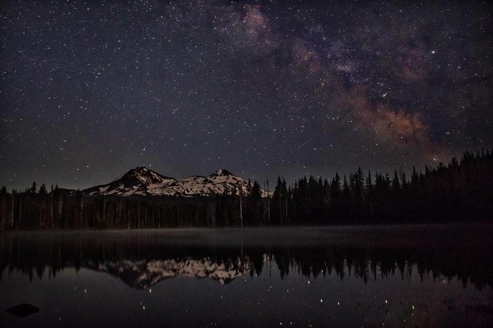 Stars in the night sky over Scott Lake near Sisters, Oregon
