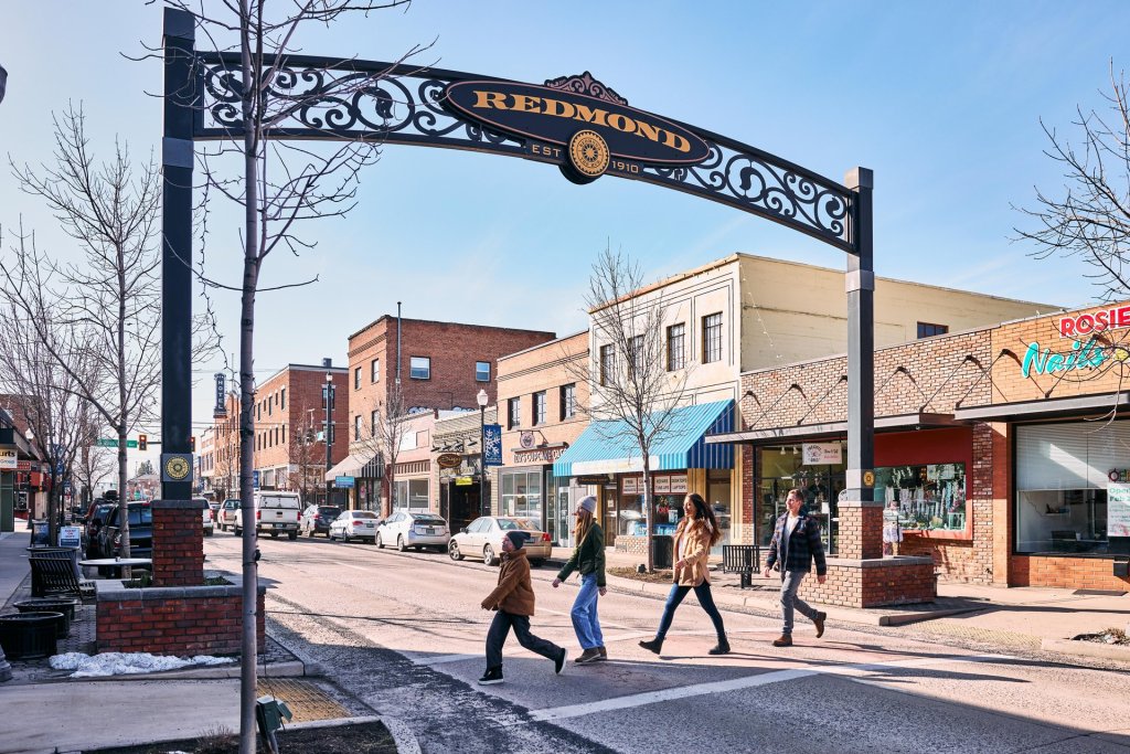 Family explores downtown Redmond, Oregon on a sunny winter day