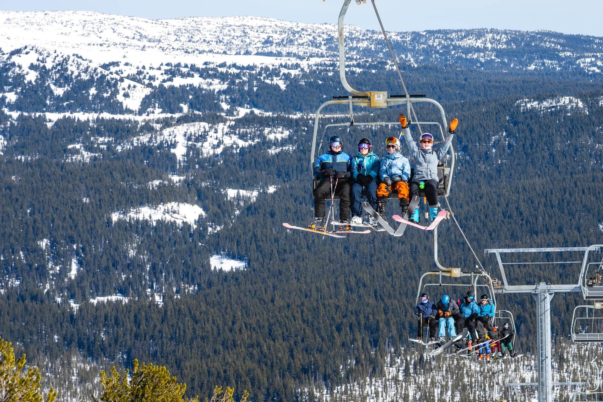 Skiers on a chairlift at Mt. Bachelor Ski Resort in Bend, Oregon