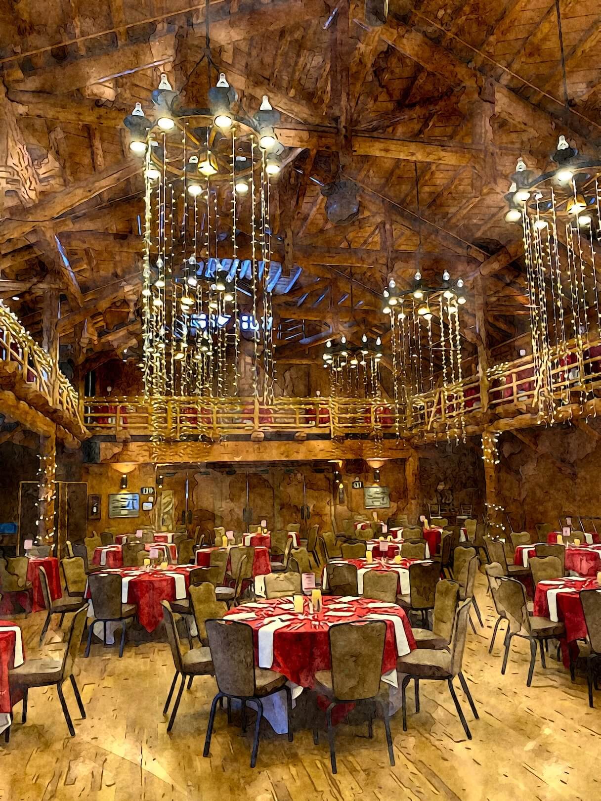 A grand dining hall with rustic charm, featuring high ceilings, wooden beams, and elegant chandeliers in Central Oregon.