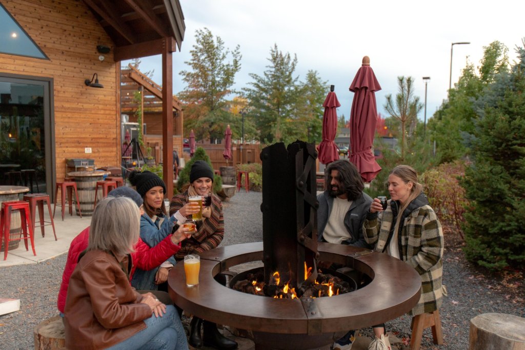 Group enjoys beers outside of Crosscut Warming Hut in Bend, oregon