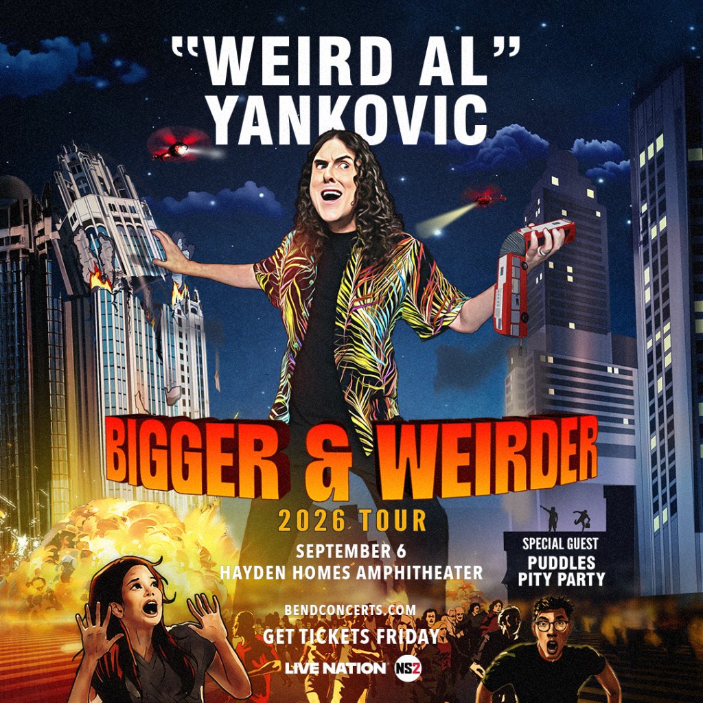 A vibrant concert poster for 'Weird Al' Yankovic's 'Bigger & Weirder' tour, featuring a chaotic scene with buildings, fire, and a helicopter in Central Oregon.