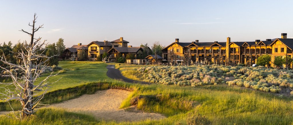 The Tom Fazio Championship Golf Course of Pronghorn Golf Club, with Juniper Preserve's hotel the Juniper Lodge in the background.