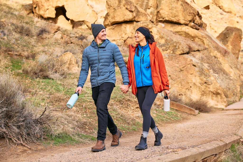 A couple hiking in winter on a trail at Smith Rock State Park near Redmond, Oregon