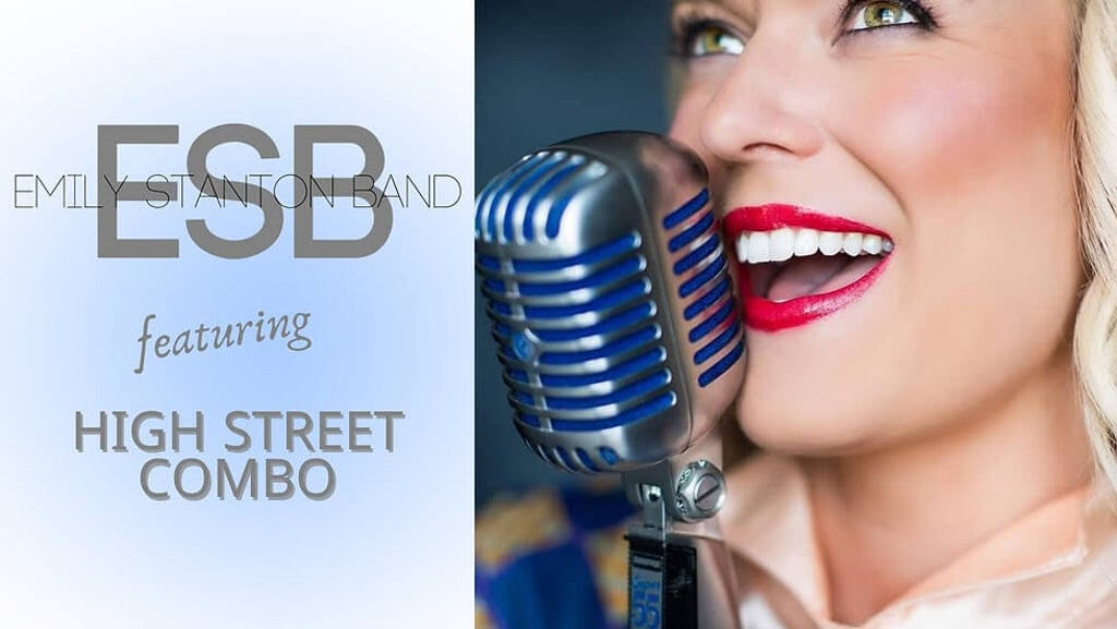 A woman passionately singing into a vintage microphone, showcasing her vibrant red lipstick and expressive smile in Central Oregon.