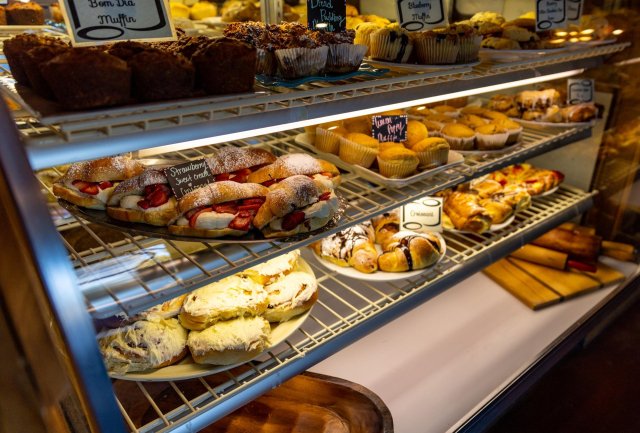 A bakery display filled with various pastries, muffins, and desserts in Central Oregon.
