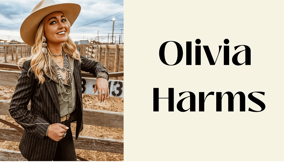 A woman in a cowboy hat and boots poses confidently in a rodeo arena in Central Oregon.
