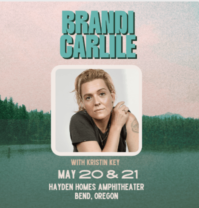 Brandi Carlile performs at a concert venue with a forest backdrop in Central Oregon.
