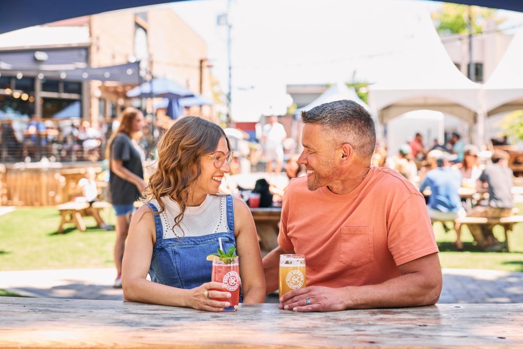 Couple sitting on the patio at Bend Brewing Company in Bend, Oregon