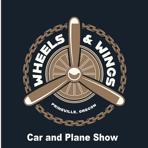A vintage propeller with the text 'Wheels & Wings' encircling it, promoting a car and plane show in Prineville, Oregon in Central Oregon.