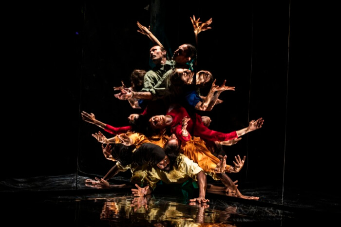 A group of dancers perform a dynamic, gravity-defying pose on stage in Central Oregon.