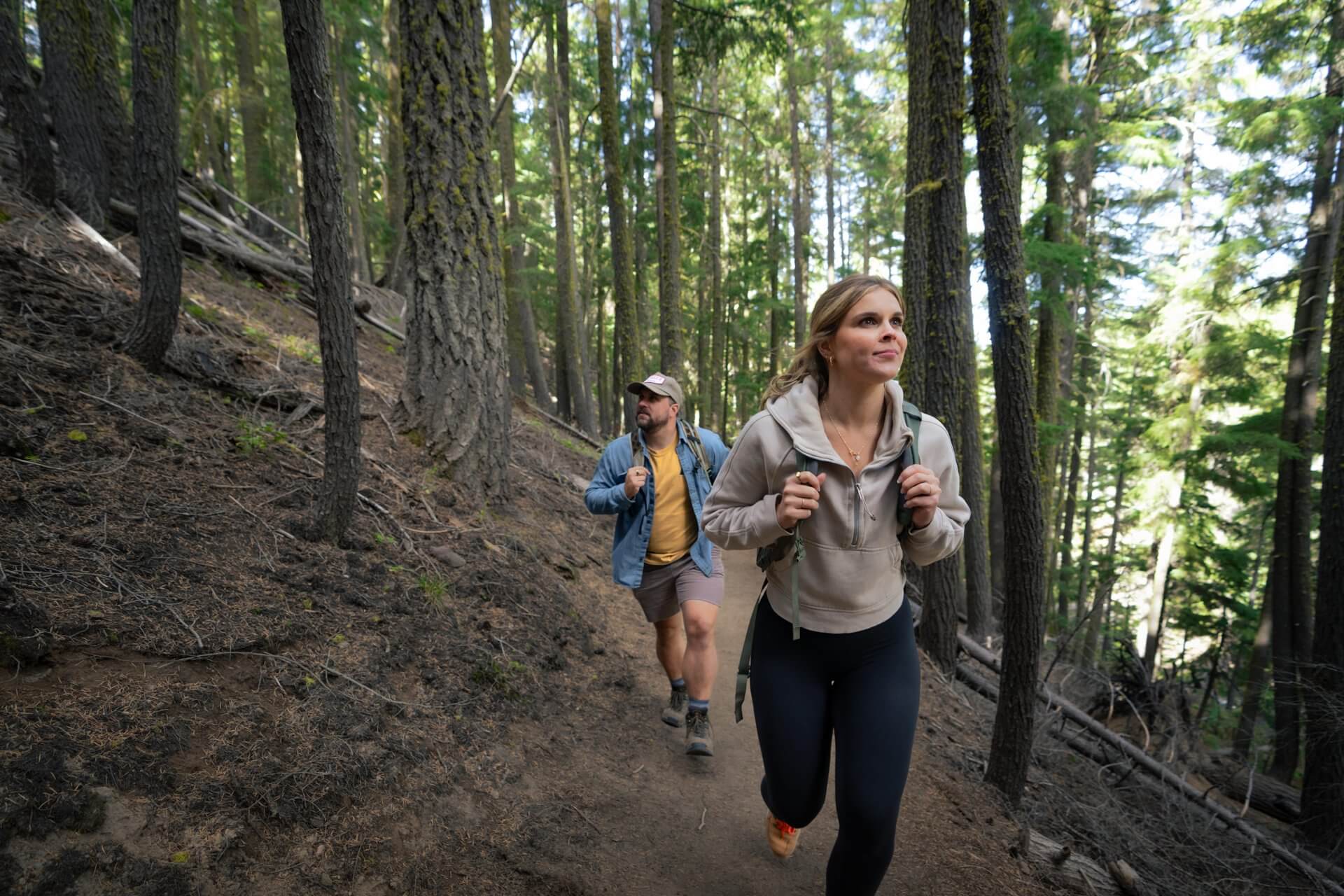 Hikers walking through a forest in Central Oregon