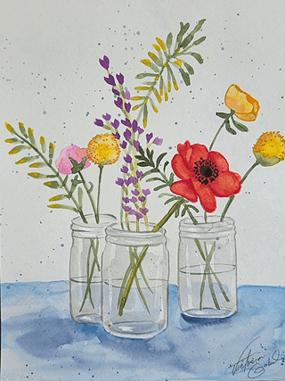 Three glass mason jars filled with colorful wildflowers, including red poppies, purple lavender, yellow daisies, and green foliage, set against a blue background in Central Oregon.