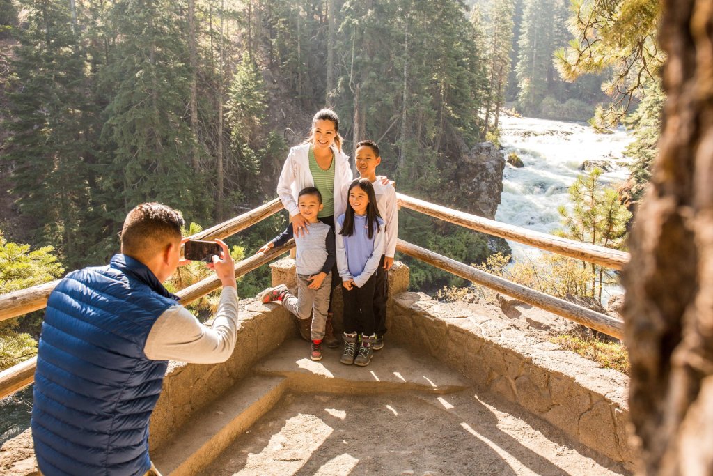 Family at the Benham Falls viewpoint on the Deschutes River Trail near Bend and Sunriver, Oregon