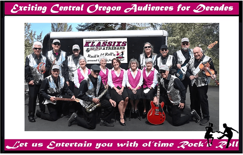 A group of senior musicians dressed in sparkly outfits pose with their instruments in front of a trailer in Central Oregon.