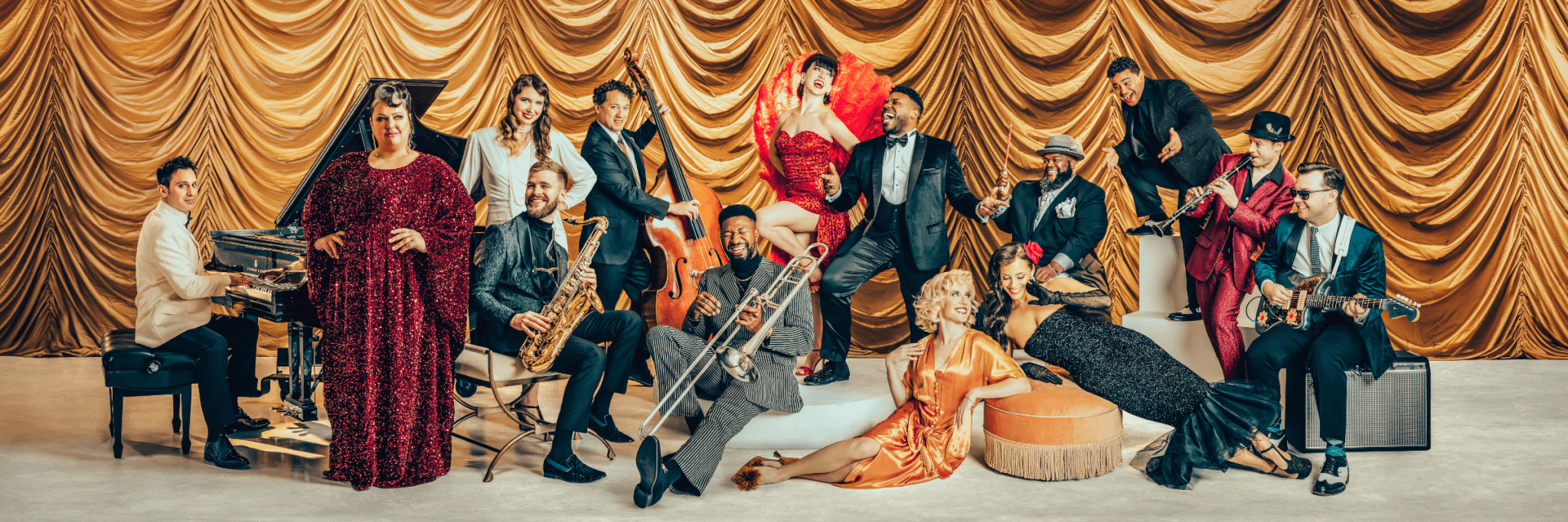 A vibrant jazz ensemble in glamorous attire performs on a stage adorned with golden curtains in Central Oregon.