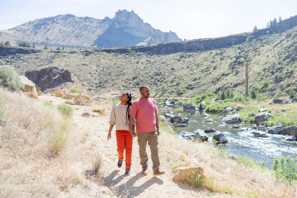 Two people enjoying the views at Smith Rock State Park near Terrebonne, Oregon