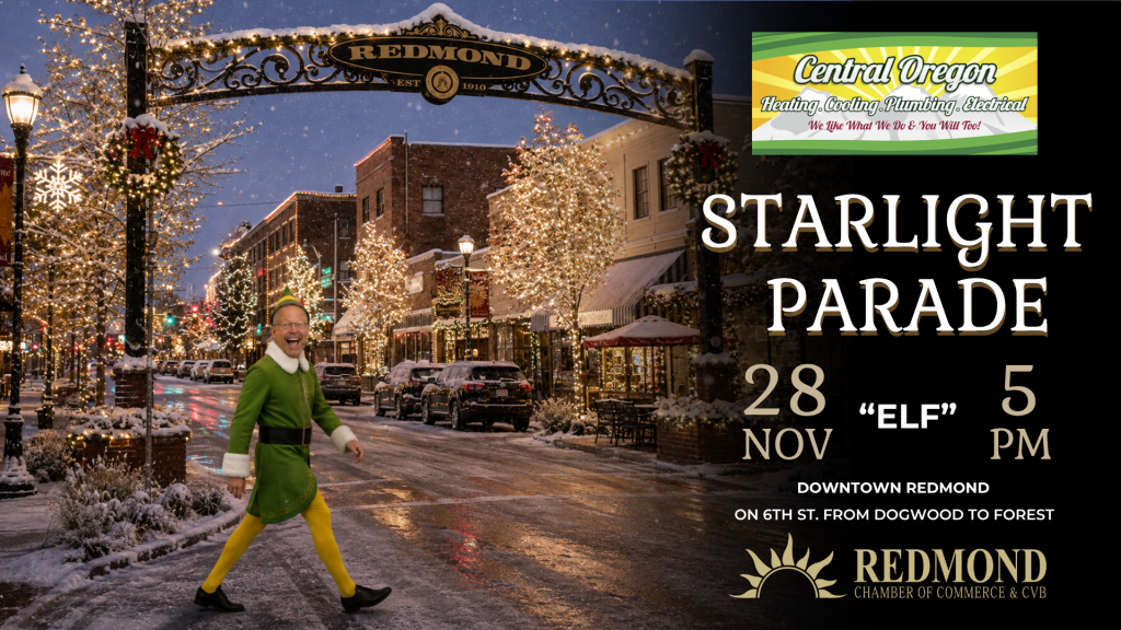 A man dressed as an elf walking down a snowy, decorated street in Redmond in Central Oregon.