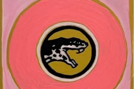 A stylized painting of a snarling panther head inside concentric circles in Central Oregon.