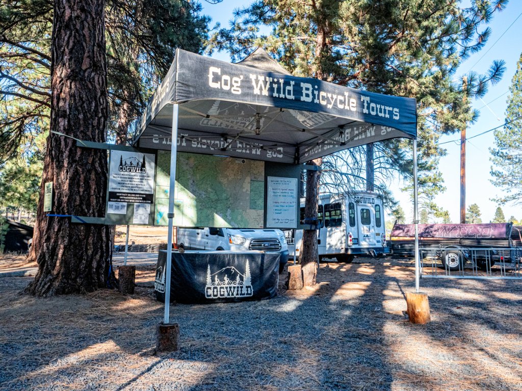 A Cog Wild Bicycle Tours canopy tent set up in a wooded area in Central Oregon.