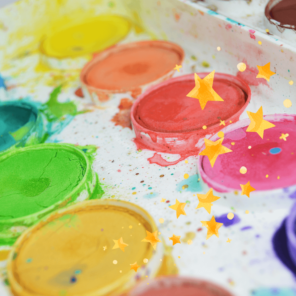 A colorful watercolor paint palette decorated with floating yellow star illustrations in Central Oregon.