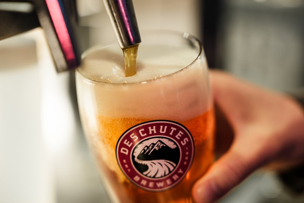 A glass of Deschutes Brewery beer being poured from a tap in Central Oregon.