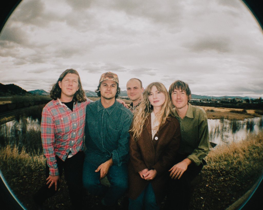 A group of five people posing together outdoors in a fisheye lens shot in Central Oregon.