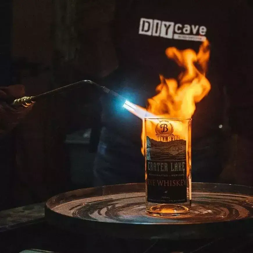 A blowtorch heating the rim of a Crater Lake Rye Whiskey bottle in Central Oregon.
