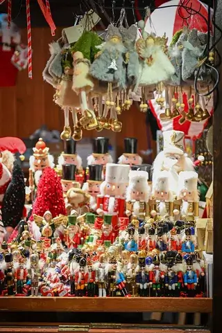 A market stall filled with numerous nutcracker figurines and hanging Christmas ornaments in Central Oregon.
