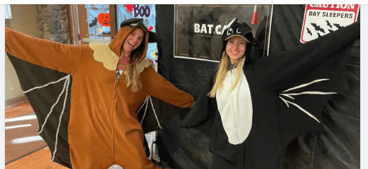 Two women wearing bat costumes posing for a Halloween photo in Central Oregon.