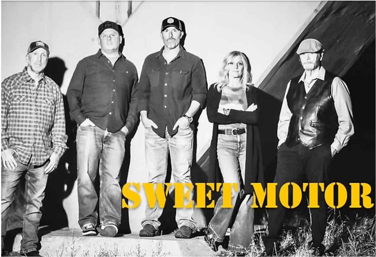 A band of five people posing for a black and white promotional photograph in Central Oregon.