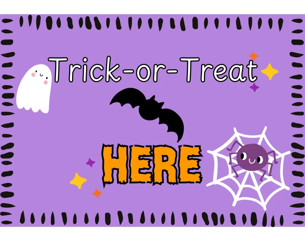 A purple Halloween sign with a ghost, bat, and spider on a web in Central Oregon.
