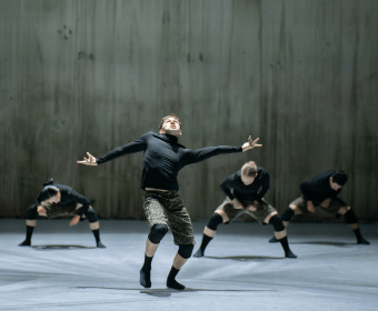 A group of dancers performing a contemporary routine on a stage in Central Oregon.