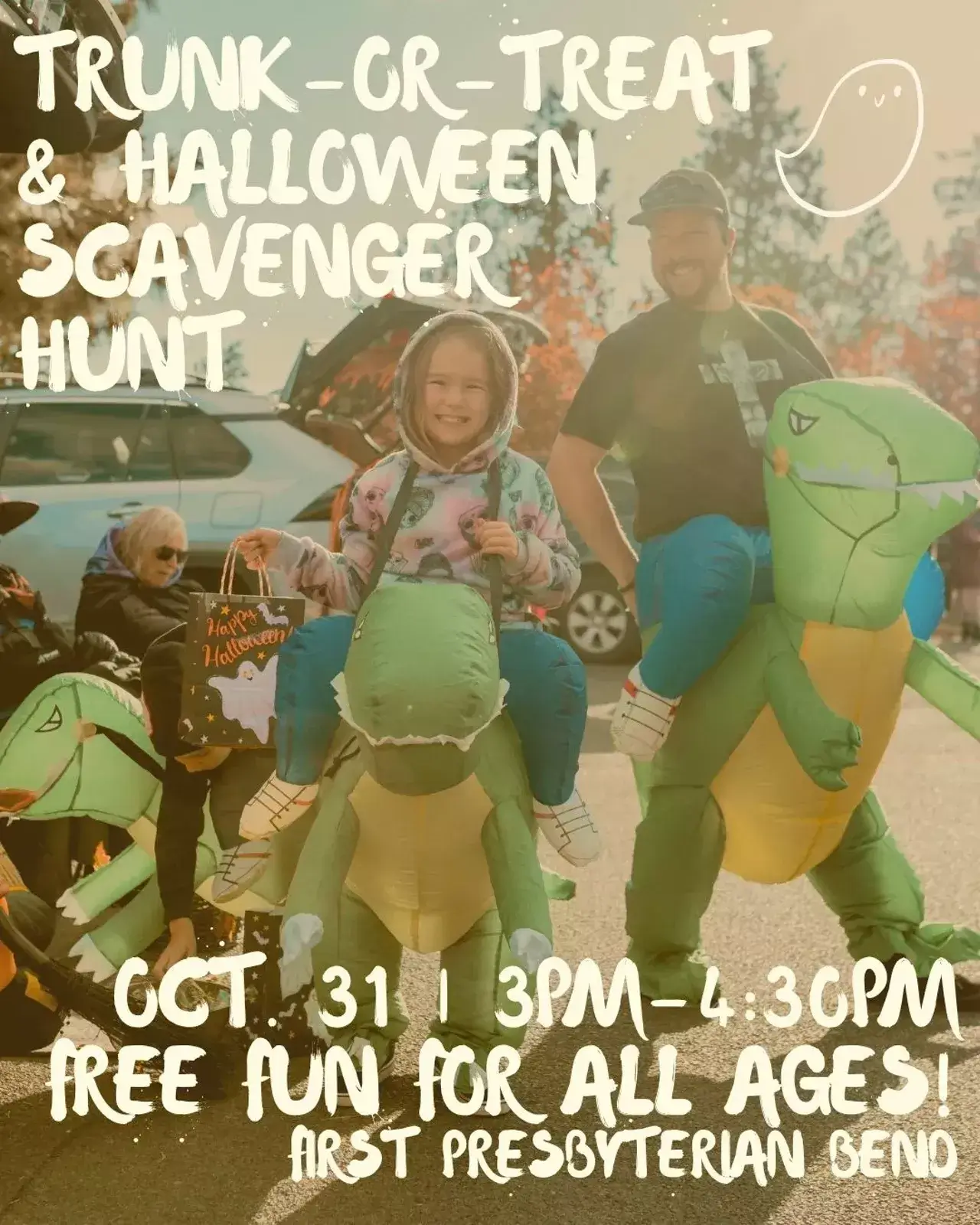A child and adult wearing inflatable dinosaur costumes at a Trunk-or-Treat event in Central Oregon.