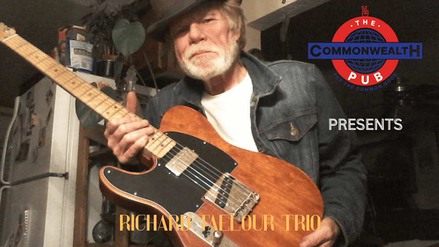 An older man with a beard and hat holding an electric guitar in Central Oregon.