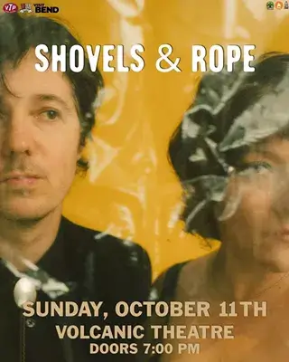 A concert poster for the band Shovels & Rope with a yellow background in Central Oregon.