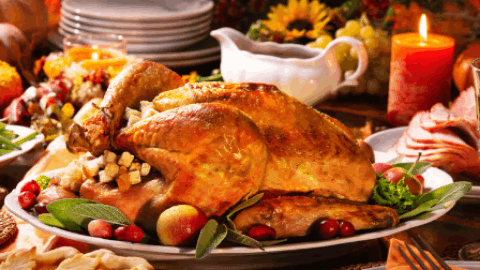 A roasted Thanksgiving turkey served on a platter with cranberries and herbs in Central Oregon.